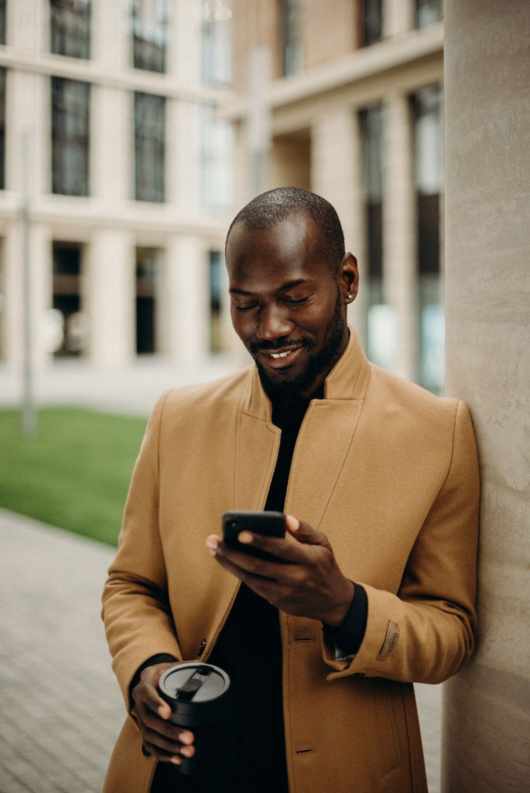 Man checking his phone outside