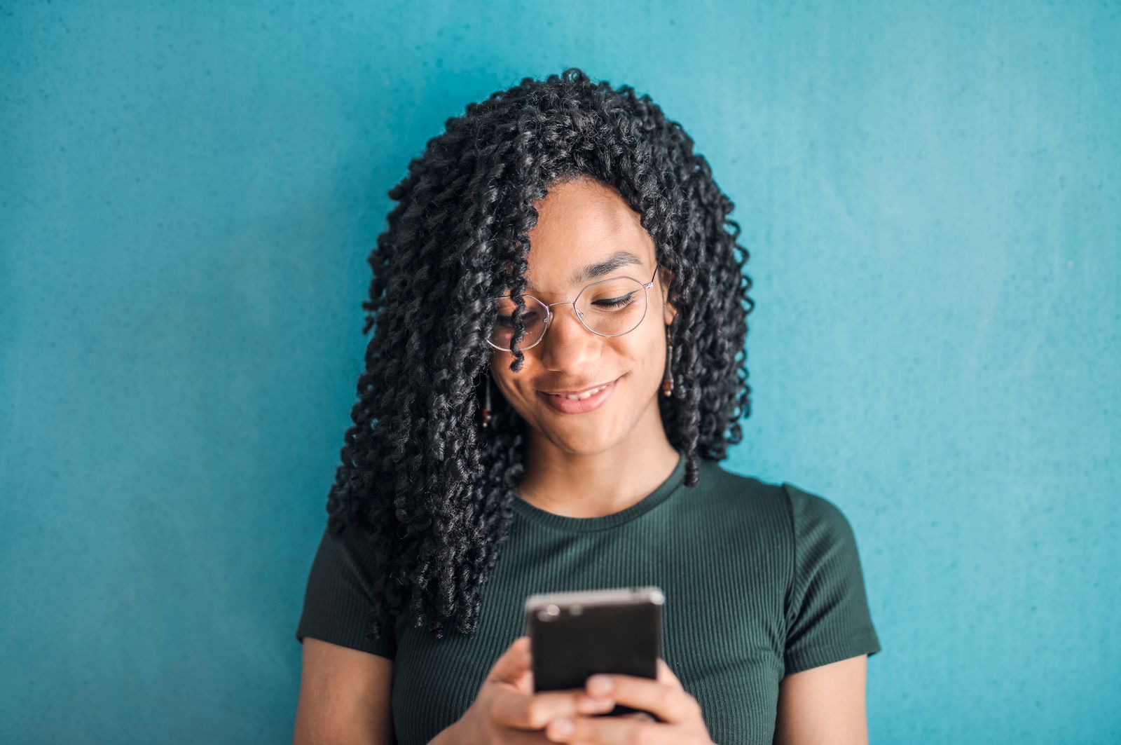 Woman smiling at her phone